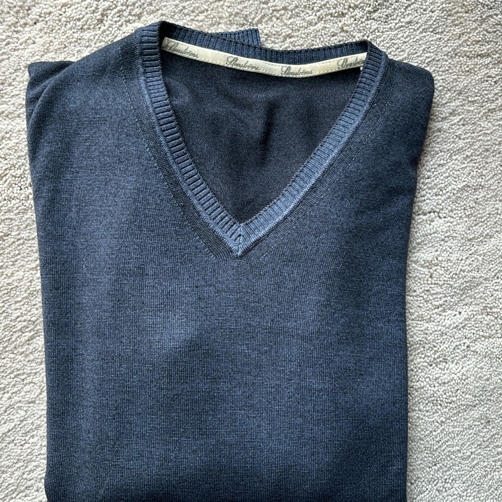Stenströms blue with lighter blue trim vee neck sweater.